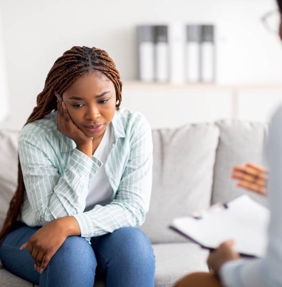 Sad,Black,Lady,Receiving,Psychological,Help,At,Mental,Clinic,,Communicating